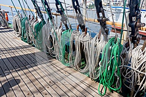 Ropes on a deck of a sailing ship. Equipment of sailing boat and ship`s exterior. Concept of travel, adventure and sea.