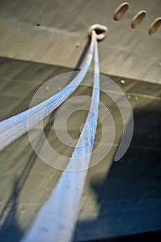 Ropes (hauling lines) of a War ship in a port