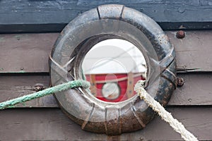 Ropes and hole in the side of the ship