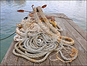 Ropes and rusty anchor