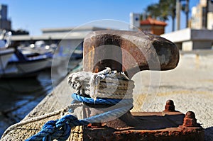Ropes tied on a rusty mooring