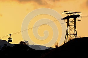 Ropeway silhouette at sunset