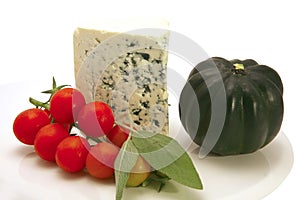Roquefort cheese triangle with cherry tomato