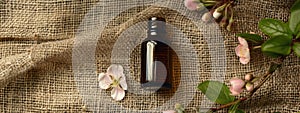 rosalina essential oil on burlap background