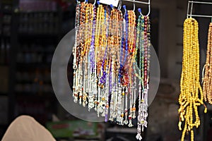 Rosaries in different colors and sizes that have fallen to the ground. It can be used for the requirements of Islamic