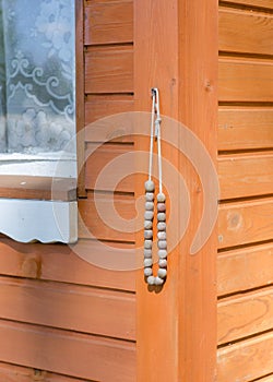 Rosaries hanging at the entrance to the house.