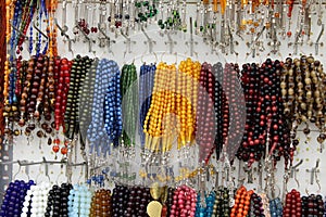 Rosaries hanging on a thread. Prayer beads on a thread