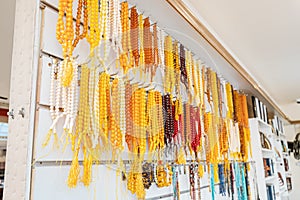 rosaries for reading prayers made by hand from amber beads for sale in the store