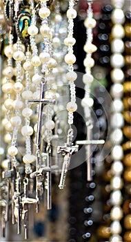 Rosaries with white beads and silver crucifixes