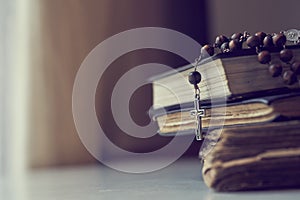 The rosary beads on Catholic Church liturgy books.