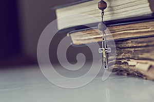 The rosary beads on Catholic Church liturgy books.