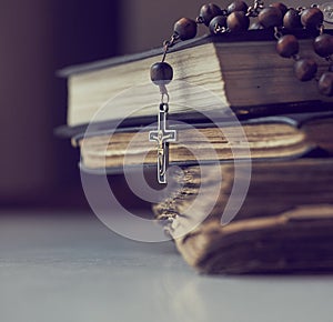 The rosary beads on Catholic Church liturgy books.