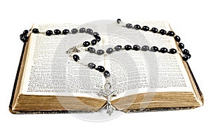 Rosary beads, cross and Bible