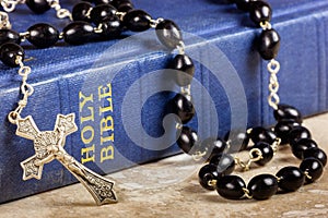 Rosary beads, cross and Bible
