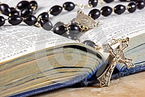 Rosary beads, cross and Bible photo