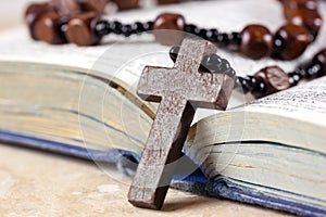 Rosary beads, cross and Bible