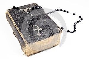 Rosary beads, cross and Bible