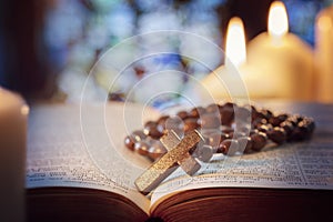 Rosary beads and crucifix cross on holy bible