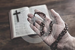 Rosary Beads and Holy Bible in church, faith, spirtuality and religion