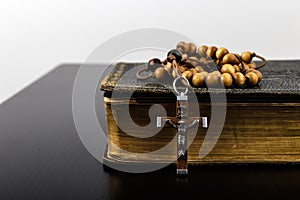 Rosary beads and prayer book photo