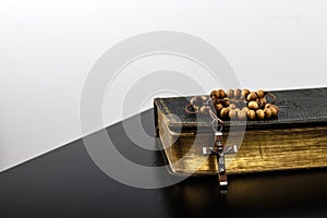 Rosary beads and prayer book photo