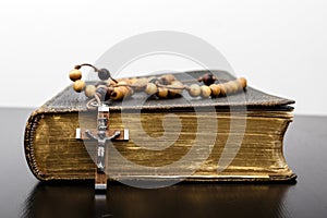 Rosary beads and prayer book photo