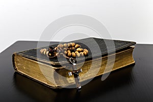 Rosary beads and prayer book photo