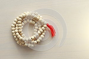 Rosary or beads from the sacred tree of Tulasi with a red tassel