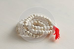 Rosary or beads from the sacred tree of Tulasi with a red tassel