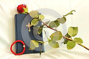 Rosary, bible and roses