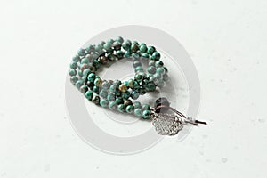 Rosary mala 108 beads from natural stones Chrysocolla Turquoise. Author`s jewelry from natural stones, Buddhism, mantra, prayer, photo