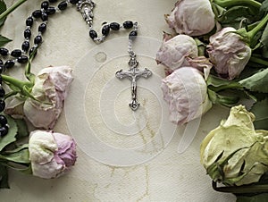 Rosary and roses, top view