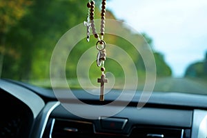 Rosary Hanging From Car Rearview Mirror