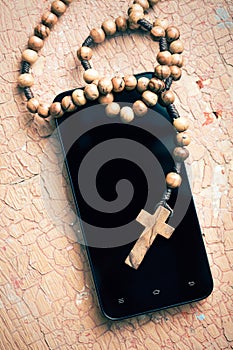 Rosary and smartphone