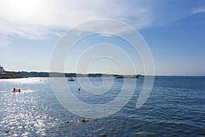 Rosas Bay in Costa Brava and one person snorkeling on the foregroung