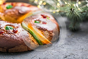 Rosca de reyes, spanish three kings cake eaten on epiphany day, on a gray rustic table photo