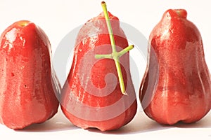 Rose apples on white.