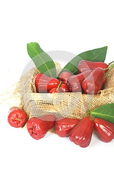 Rose apples on wooden crate