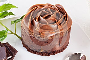 Rose chocolate mousse cake on a beautiful plate cream