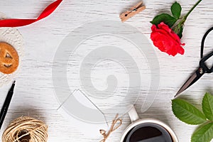 Rose, coffee, scissors and other small objects on the white on t