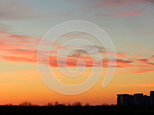 A rose-colored sunset over a northern Russian town