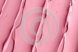 Rose cosmetic clay alginate facial mask, face cream, body wrap texture close up, selective focus. Abstract background with brush