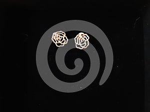 Rose earrings on black photo