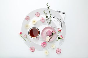 Rose flowers with tea and macarons