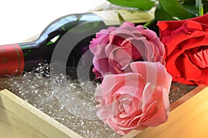 Rose flowers and wine bottle