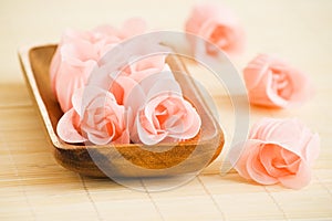 Rose flowers in wood tray