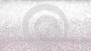 Rose gold pink blur glitter bokeh background with blurry silver white sparkling light of metallic texture shimmering backdrop