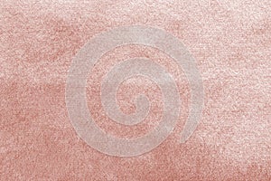 Rose gold pink velvet background or velour flannel texture made of cotton or wool with soft fluffy velvety satin fabric photo