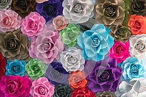 Rose made from paper. Handmade roses backdrop. Collection of many colorful origami roses forming a beautiful floral pattern
