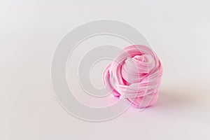 Rose made of solid plasticine on a light background. The concept of children`s creativity